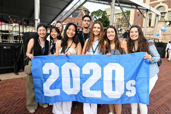 Alumni get the Convocation program underway with the Parade of Decades, including the most recent.